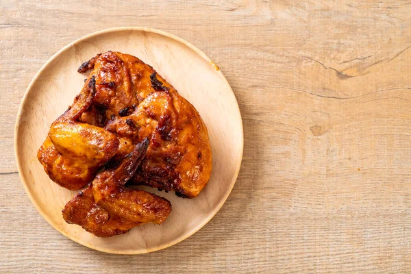 grilled and barbecue chicken on table