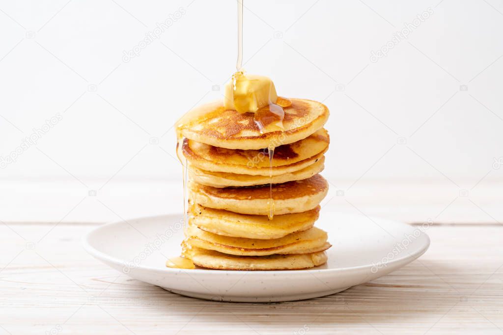 pancakes stack with butter and honey