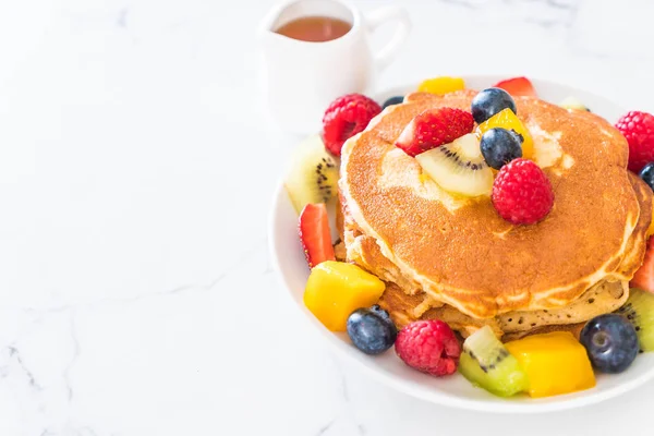 pancake with mix fruits (strawberry, blueberries, raspberries, mango, kiwi)