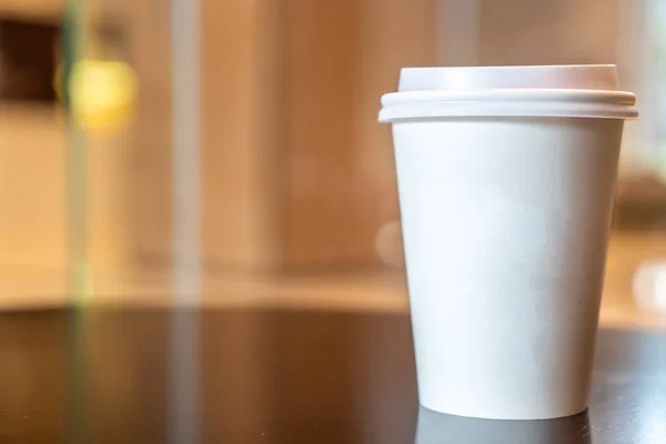 hot coffee paper cup in coffee shop and cafe