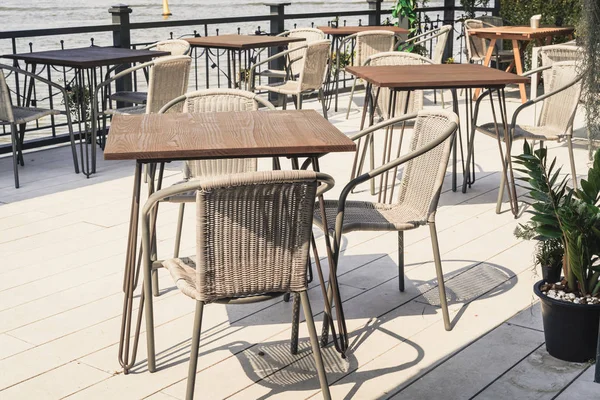 empty outdoor patio table and chair in restaurant and coffee shop