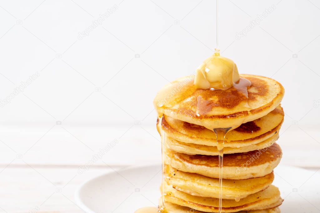 pancakes stack with butter and honey