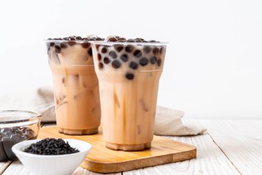 Taiwan milk tea with bubble on wood background clipart