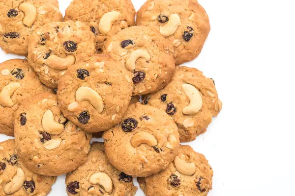 cookies with raisin and roasted cashew nuts isolated on white background