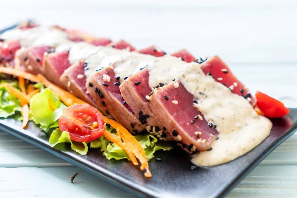 fresh tuna raw with vegetable salad and sauce - healthy food