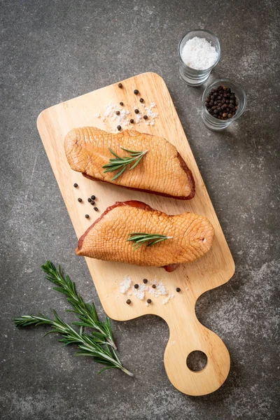 fresh raw duck breast on wood board with ingredients