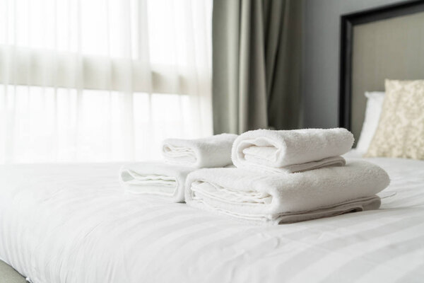 white towel decoration on bed in bed room interior