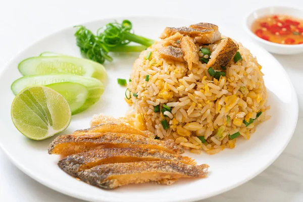 fried rice with crispy gourami fish - Asian food style