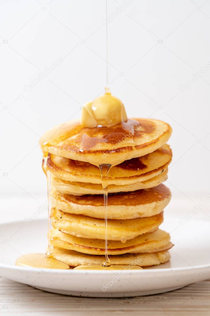 pancakes stack with butter and honey