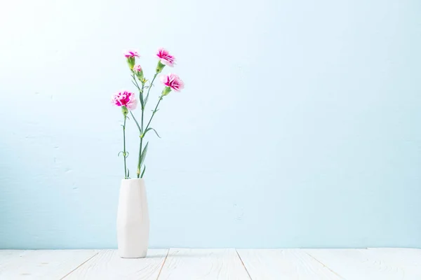 pink spring flower on wood background with copy space
