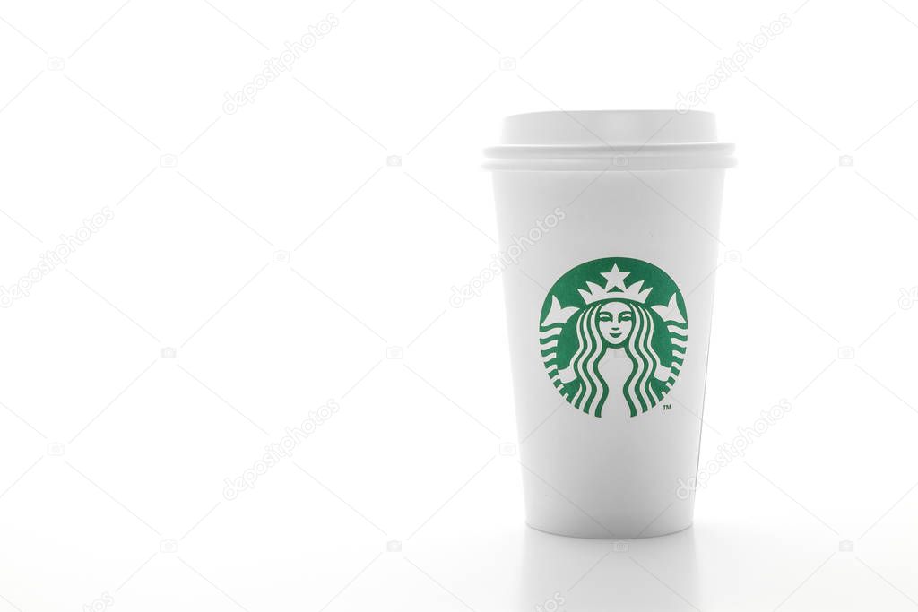 BANGKOK, THAILAND - JUN 5, 2018: White coffee cup with Starbucks logo isolated on white background. Starbucks is the world's largest coffee house with over 20,000 stores in 61 countries.
