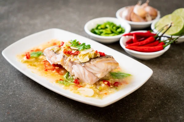 stock image Steamed Grouper Fish Fillet with Chili Lime Sauce in lime dressing - Asian food style