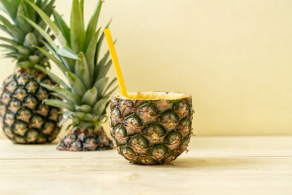 Fresh pineapple smoothie glass on wood table — Stock Photo, Image