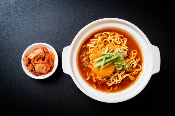 korean spicy instant noodles with egg, vegetable and kimchi
