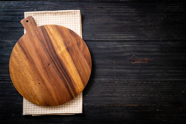 stock image empty cutting wooden board with kitchen cloth