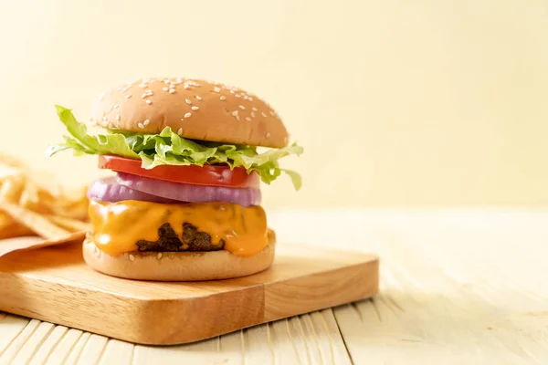 Fresh tasty beef burger with cheese and french fries — Stock Photo, Image