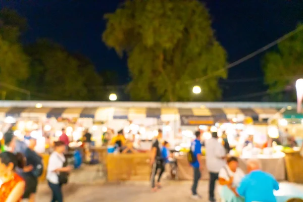 Difuminación abstracta y mercado callejero nocturno desenfocado — Foto de Stock