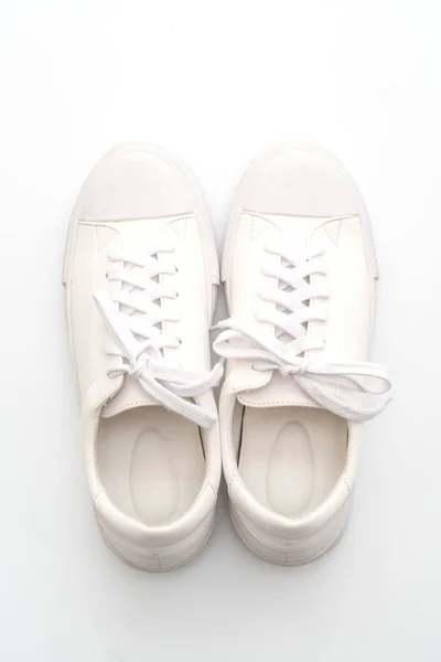 Zapatillas blancas sobre fondo blanco — Foto de Stock