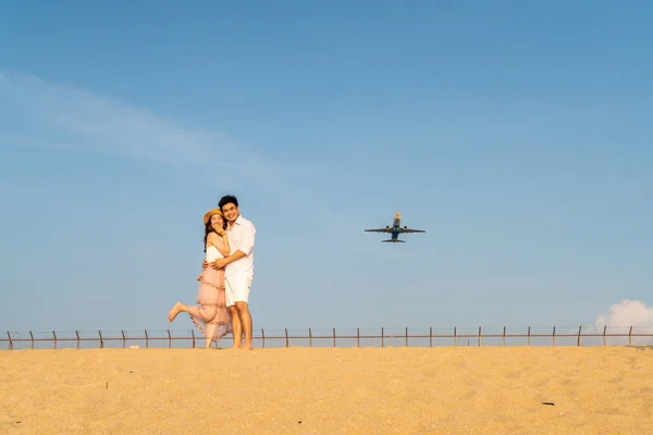 Happy Asian couple in love with blue sky — Stock Photo, Image