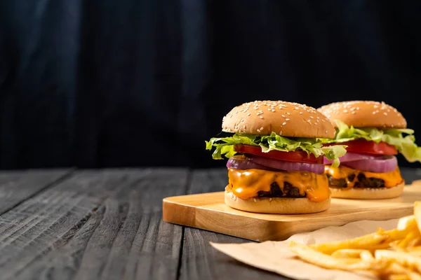 stock image fresh tasty beef burger with cheese and french fries