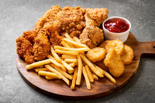 fried chicken with french fries and nuggets meal