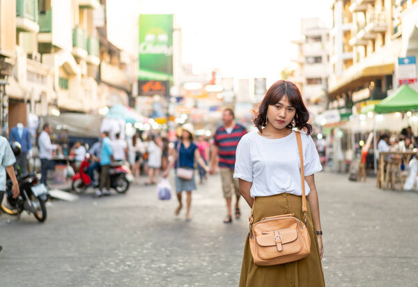 Happy and Beautiful Asian woman traveling at Khao Sarn Road, Tha