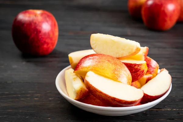 Fresh red apples sliced bowl — Stock Photo, Image