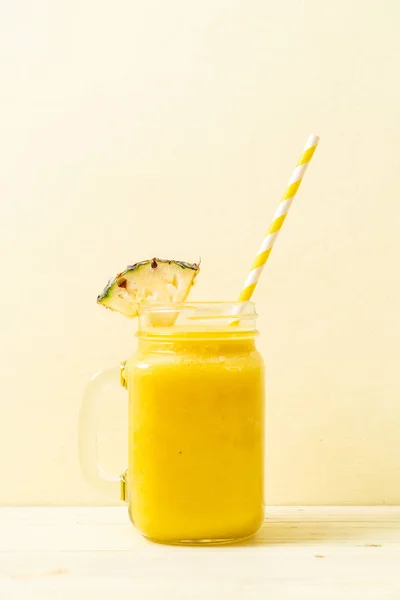 Fresh pineapple smoothie glass on wood table — Stock Photo, Image