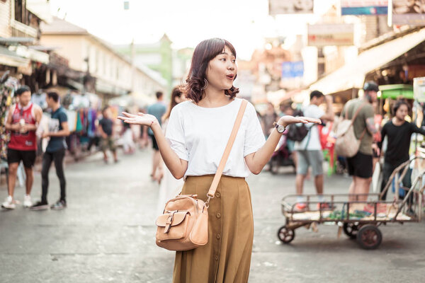 Happy and Beautiful Asian woman traveling at Khao Sarn Road, Tha