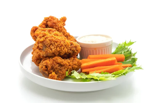 fried spicy chicken wings with vegetable