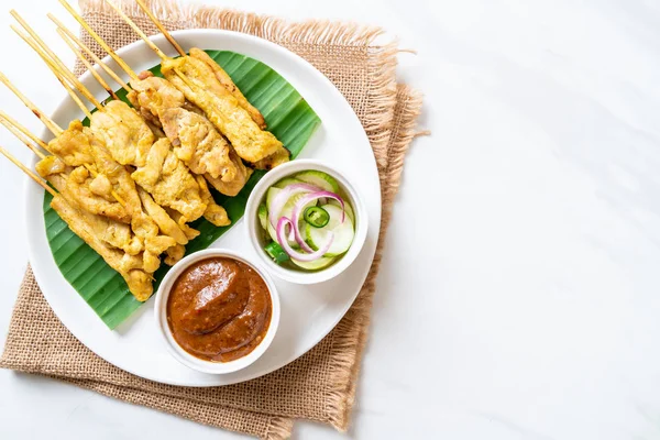 Pork satay - Grilled pork served with peanut sauce or sweet and — Stock Photo, Image