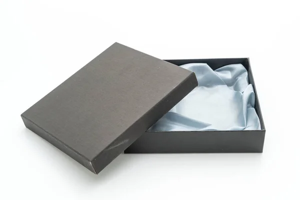 Caja de regalo negra sobre fondo blanco Imagen de stock