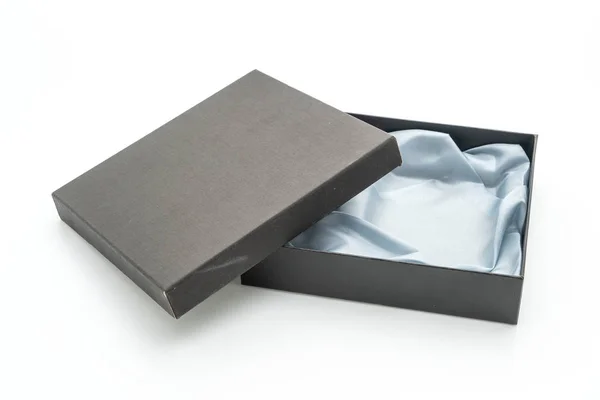 Schwarze Geschenkbox auf weißem Hintergrund lizenzfreie Stockbilder