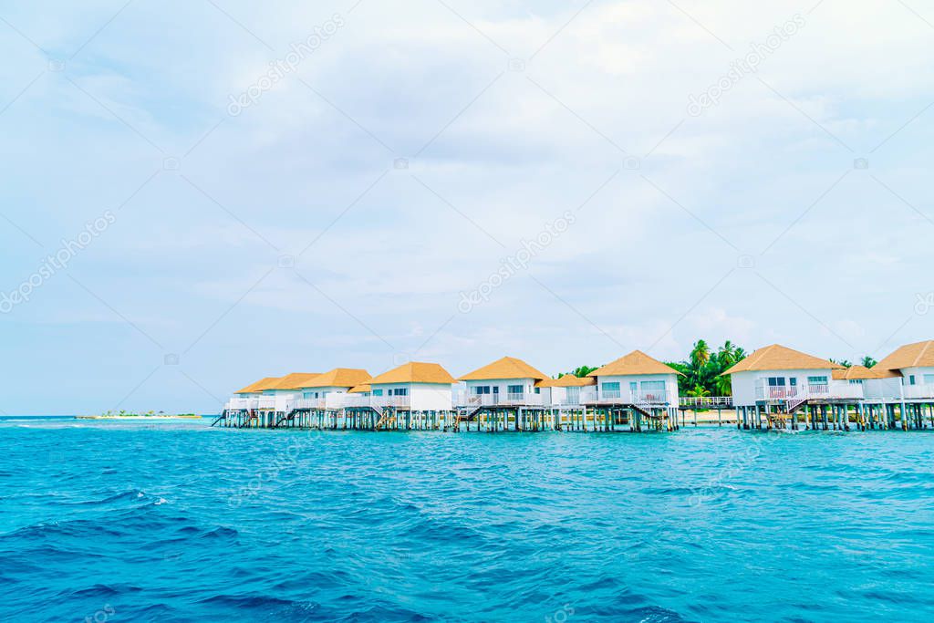 tropical Maldives resort hotel and island with beach and beautif