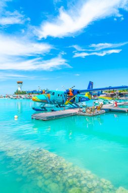 MALE, MALDIVES - MAY/20/2019: Seaplane of Trans Maldivian Airway clipart