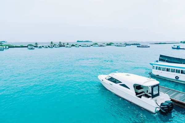 HULHULE, MALDIVES - MAY 23, 2019: Boats and ferries at the harbo