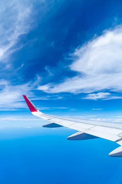 Clouds and sky as seen through window of an aircraft — Stock Photo, Image
