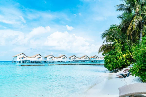 Beach chair with tropical Maldives resort hotel island and sea — Stock Photo, Image