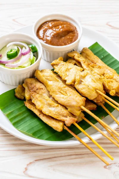 Pork satay - Grilled pork served with peanut sauce or sweet and — Stock Photo, Image
