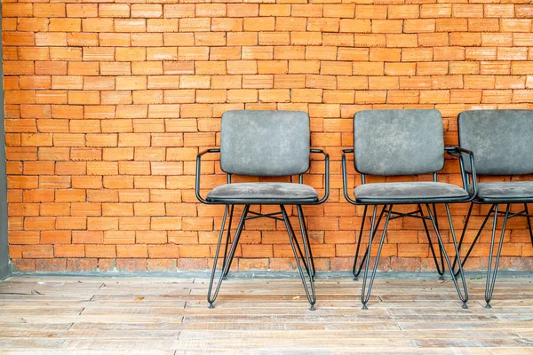 chair with brick wall