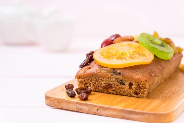 Fruit cake on wood — Stock Photo, Image