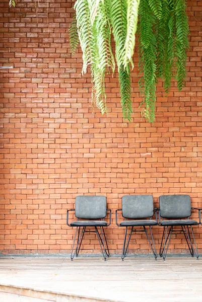 chair with brick wall