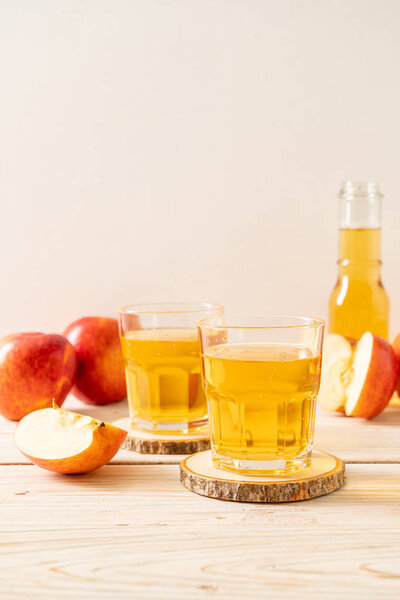 Apple juice with red apples fruits