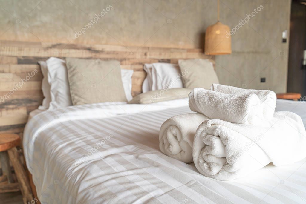 White towel on bed decoration in bedroom 
