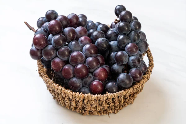 Fresh black grapes on white background — Stock Photo, Image