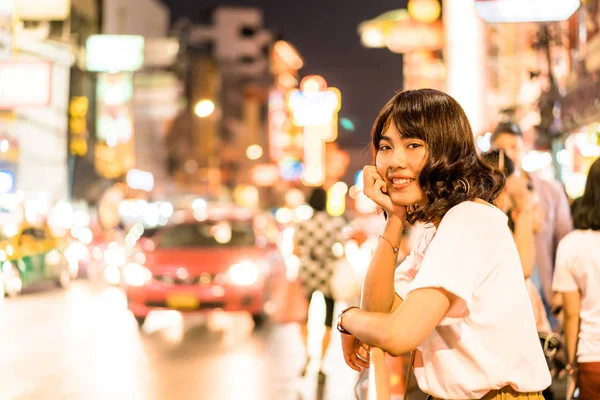 Young Asian Woman Traveler with view at China Town in Bangkok, T