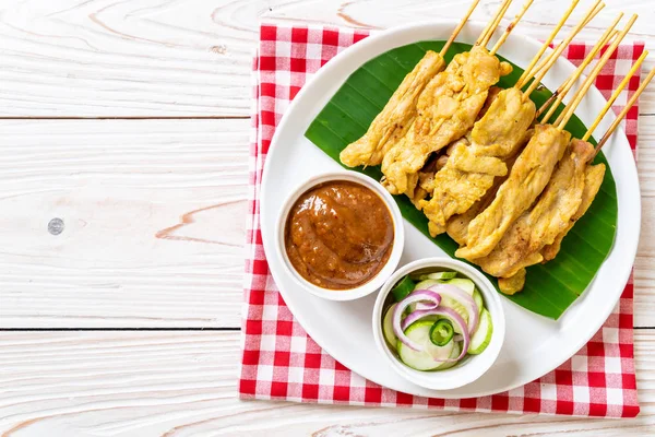 Pork satay - Grilled pork served with peanut sauce or sweet and — Stock Photo, Image