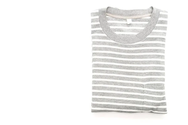 Camiseta a rayas dobladas sobre fondo blanco —  Fotos de Stock