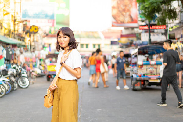 Happy and Beautiful Asian woman traveling at Khao Sarn Road, Tha