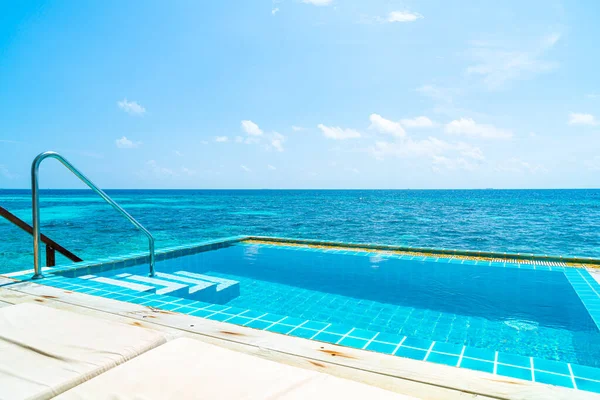 swimming pool with sea background in Maldives